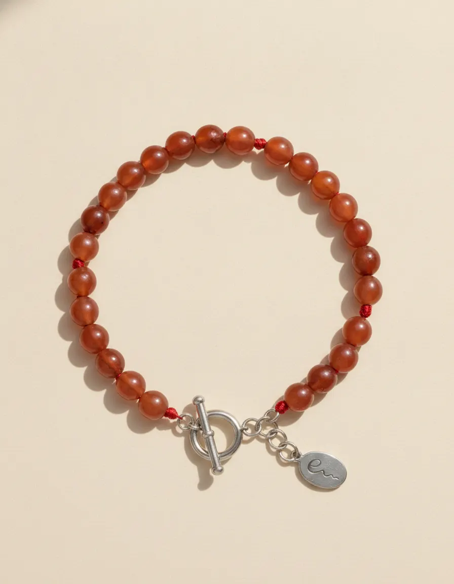 Fire bracelet Emberstitch, beaded with toggle clasp and River E tag on ivory