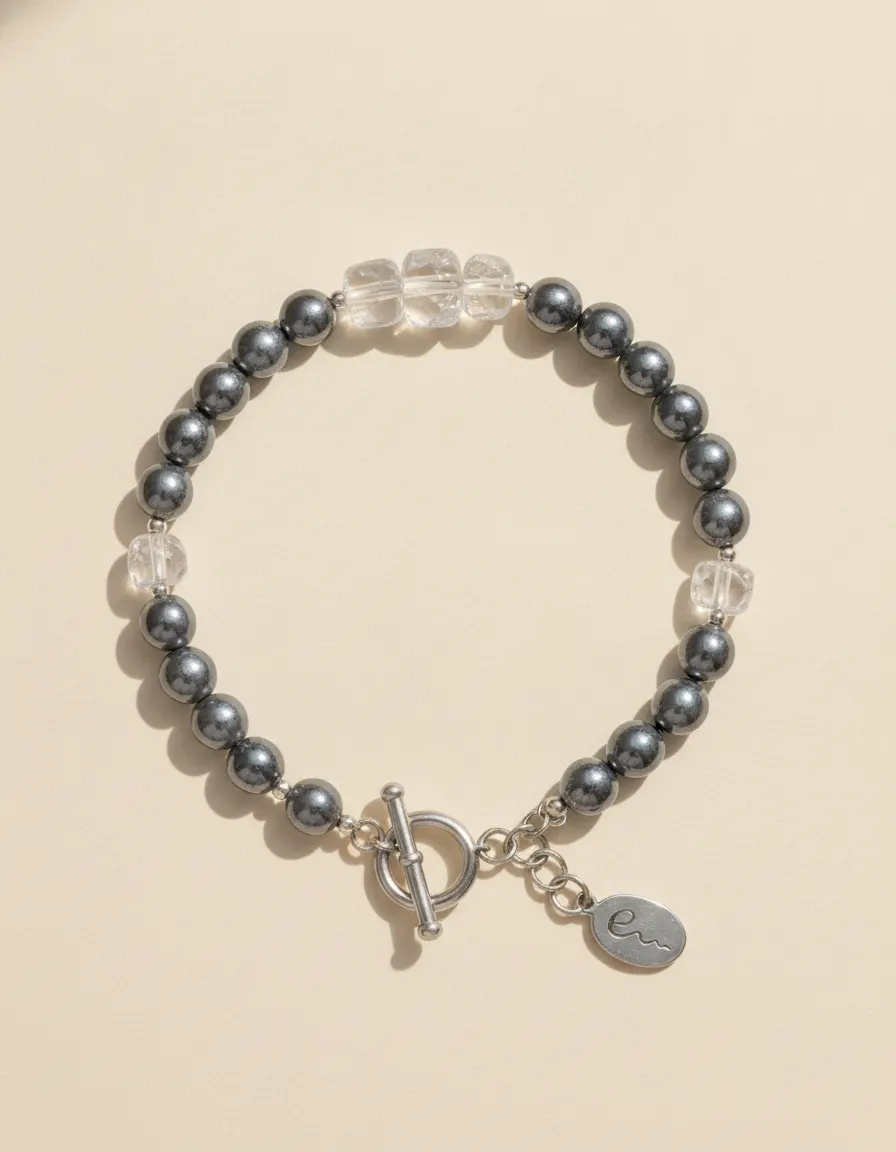 Metal bracelet Graphite, beaded with toggle clasp and River E tag on ivory