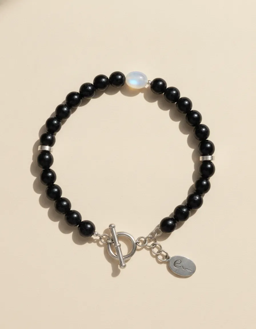 Water bracelet Inkpool, beaded with toggle clasp and River E tag on ivory