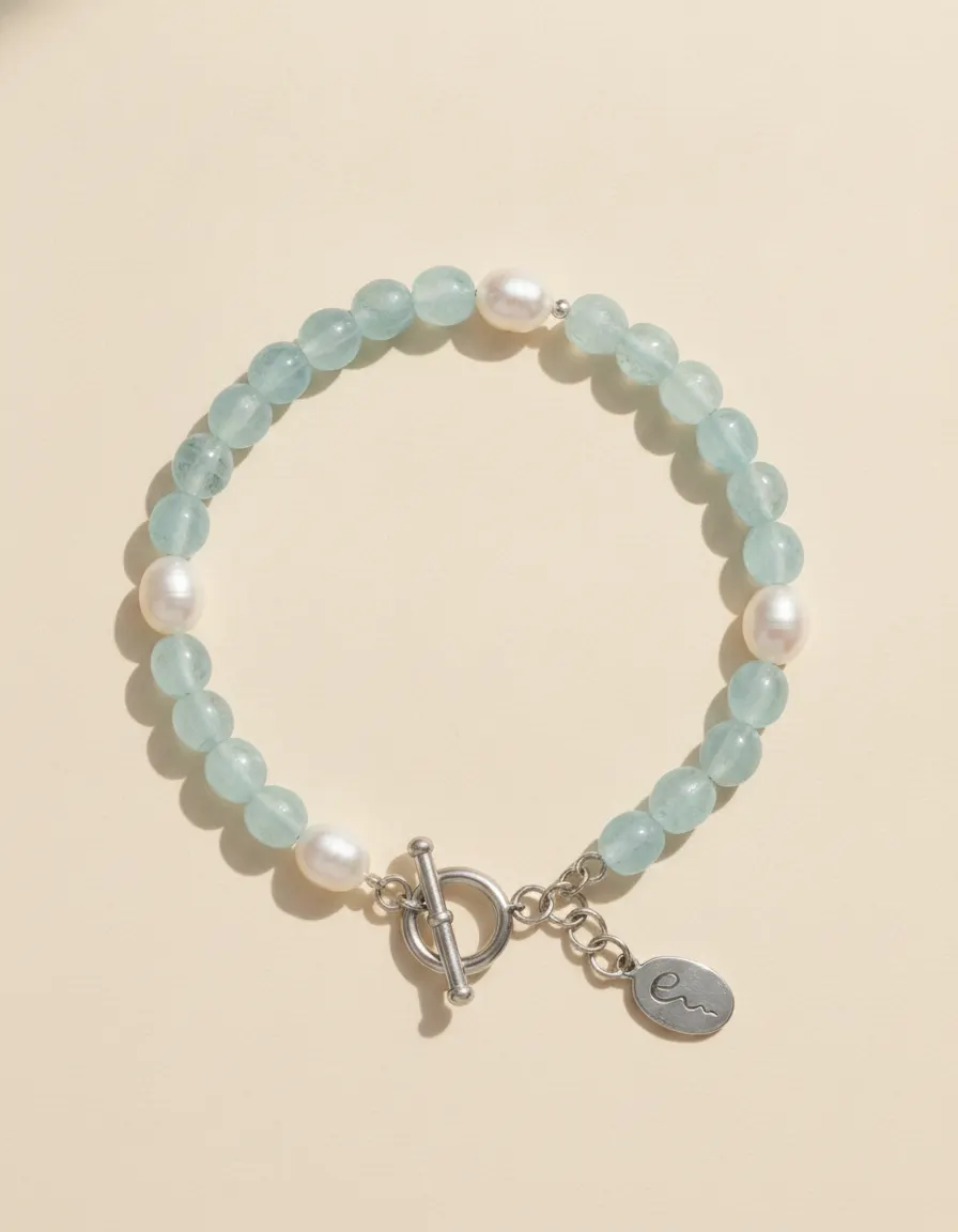 Water bracelet Tidepool, beaded with toggle clasp and River E tag on ivory