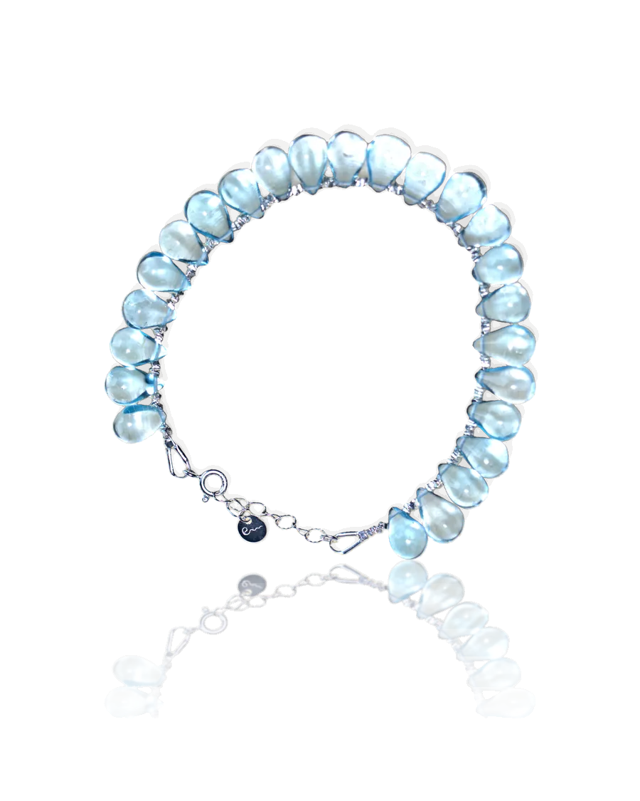 Water bracelet: pale blue teardrop stones on a silver chain with a spring-ring clasp and River E tag