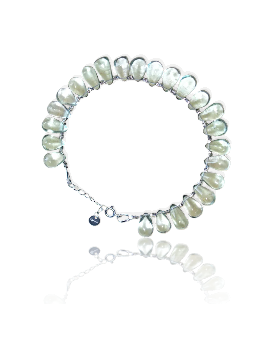 Wood bracelet: pale green teardrop stones on a silver chain with a spring-ring clasp and River E tag